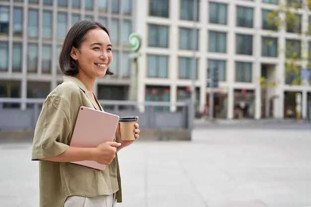 A student is illustrated walking around campus with a smile, symbolising a vibrant campus culture and adequate support for student wellbeing.